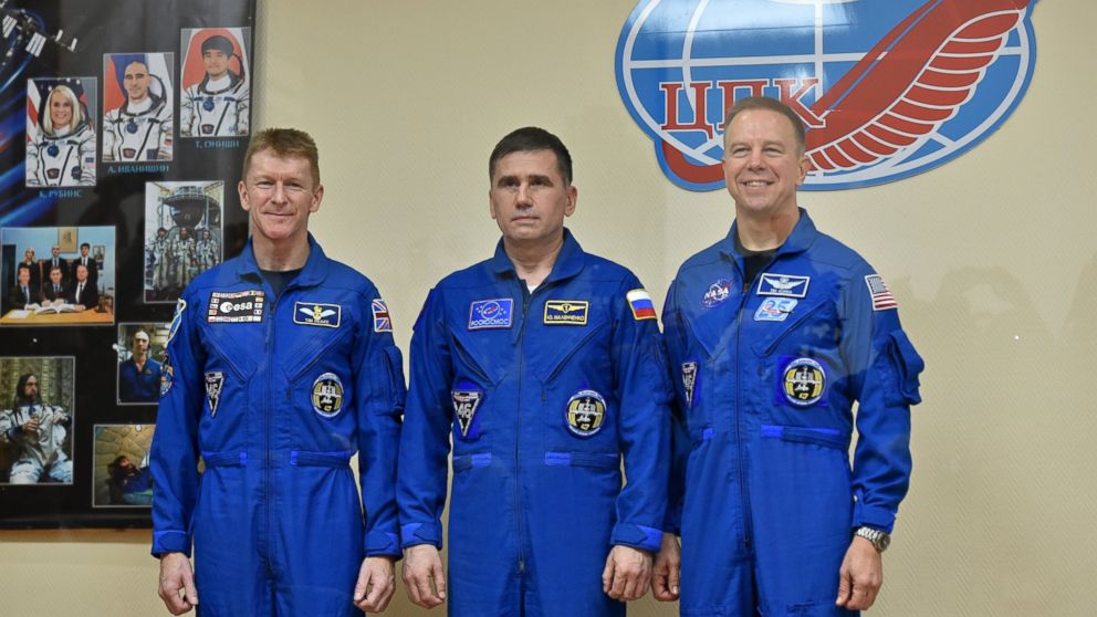 Members of the main crew of the 46/47 expedition to the International Space Station (ISS), (L-R) Britain's astronaut Tim Peake, Russian cosmonaut Yuri Malenchenko and US astronaut Tim Kopra pose after a press conference at the Russian-leased Baikonur cosmodrome in Kazakhstan on Dec. 14, 2015. 