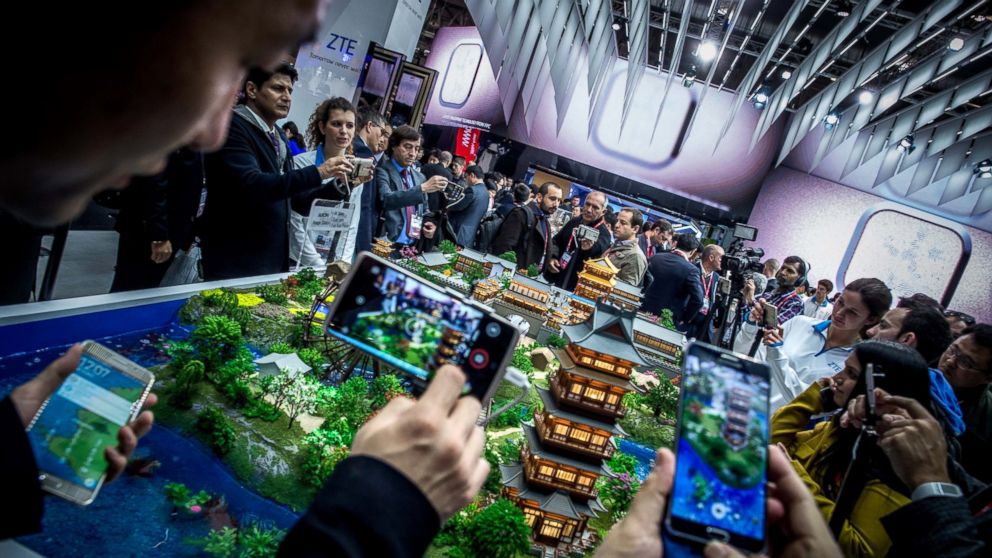 Visitors check new ZTE devices on the opening day of the World Mobile Congress at the Fira Gran Via Complex on Feb. 22, 2016 in Barcelona, Spain. 