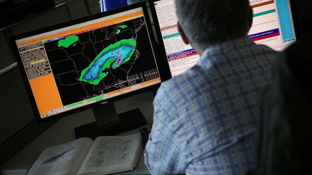 A forecaster analyses data of an incoming winter storm January 21, 2016 at the NOAA Center for Weather and Climate Prediction in College Park, Md. 