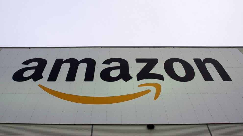 The Amazon logo is displayed on the Brieselang logistics center, west of Berlin, on Nov. 11, 2014. 