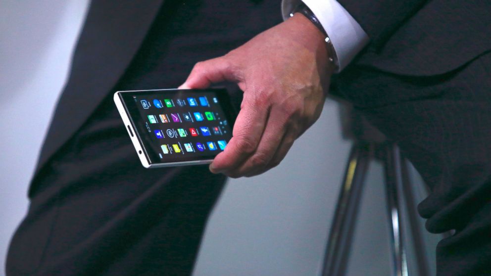 John Chen, chief executive officer of BlackBerry Ltd., holds the new Leap smartphone while speaking during a Bloomberg Television interview in Barcelona, Spain, March 3, 2015.