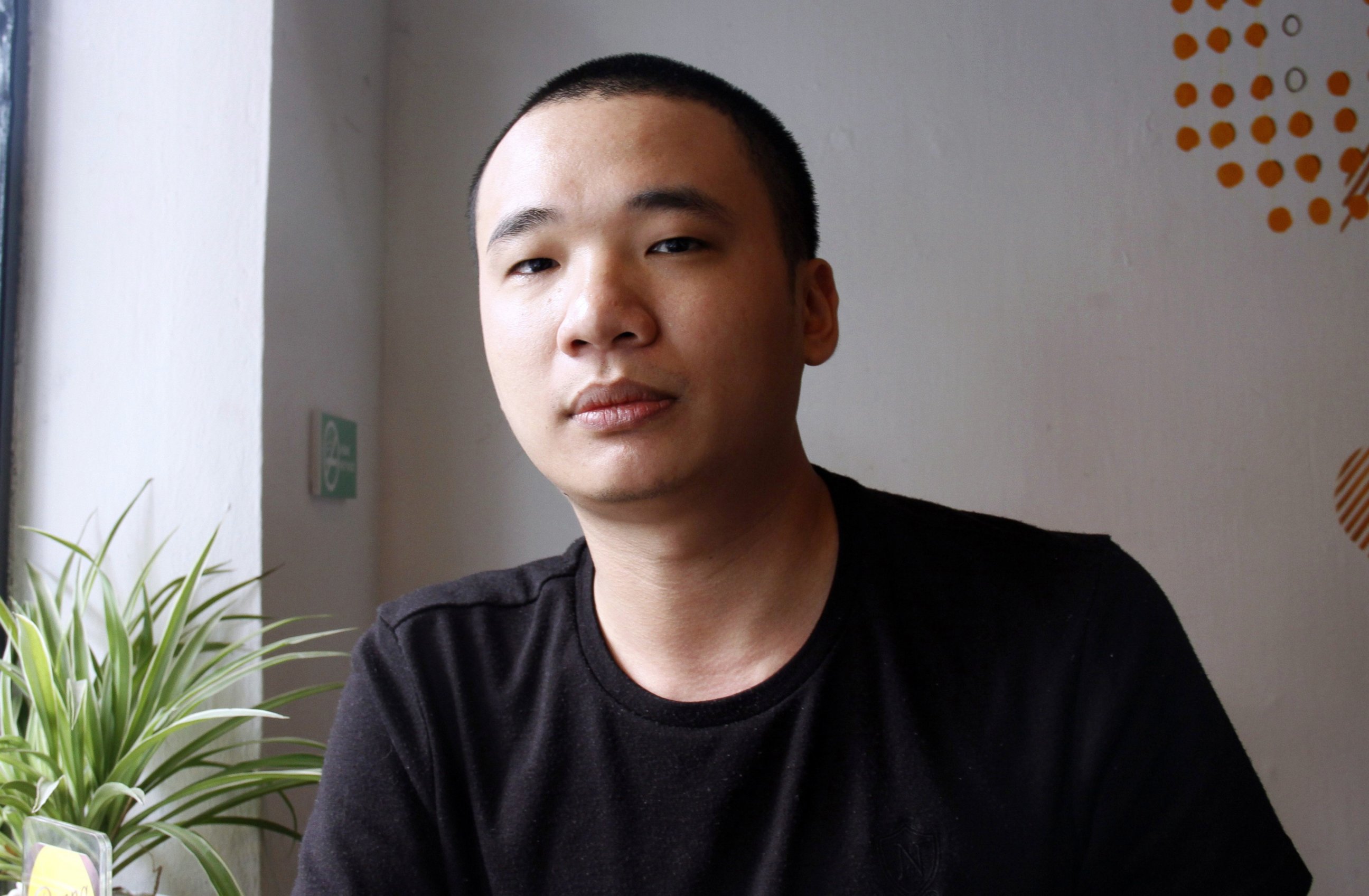 PHOTO: Nguyen Ha Dong, the author of the game Flappy Bird, relaxes inside a coffee shop in Hanoi, Vietnam, Feb. 5, 2014.