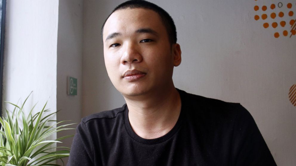 Nguyen Ha Dong, the author of the game Flappy Bird, relaxes inside a coffee shop in Hanoi, Vietnam, Feb. 5, 2014.
