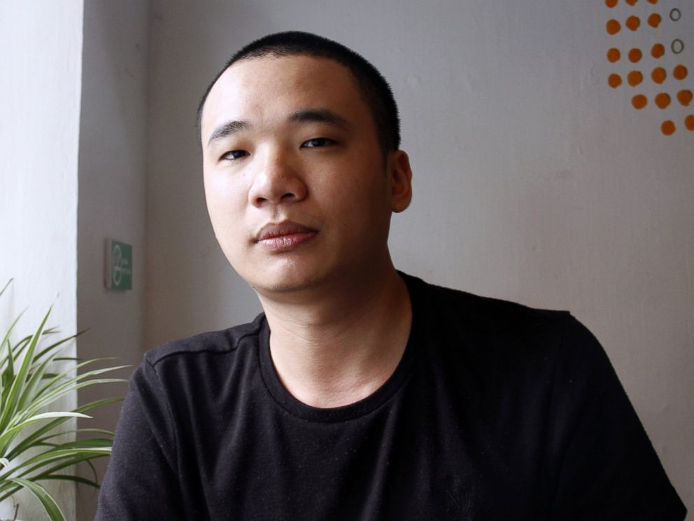 PHOTO: Nguyen Ha Dong, the author of the game Flappy Bird, relaxes inside a coffee shop in Hanoi, Vietnam, Feb. 5, 2014.