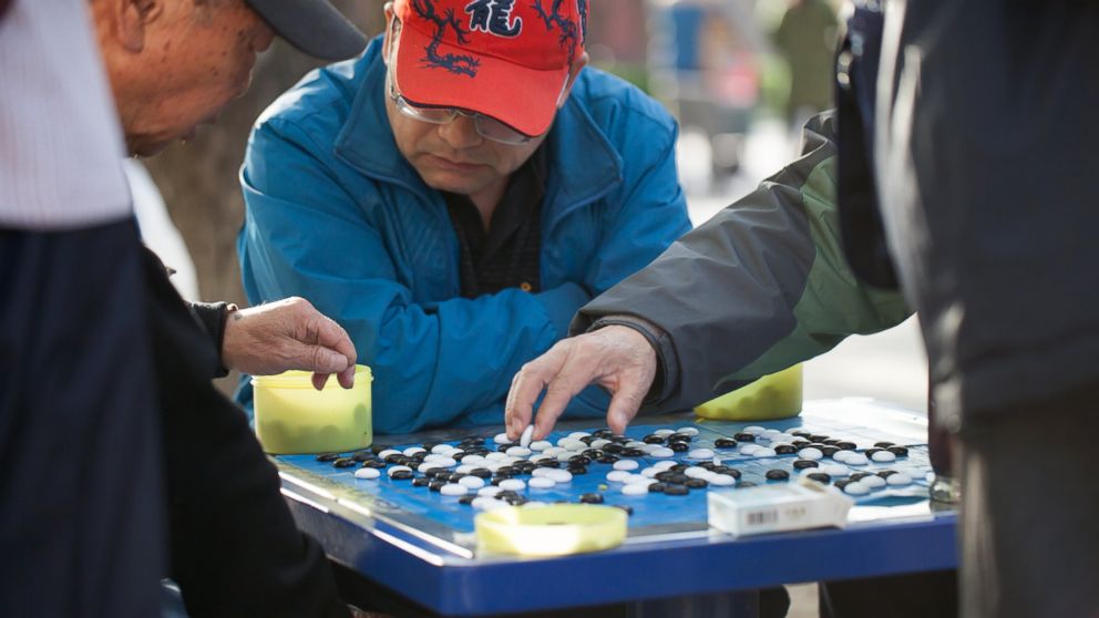 People play the game of Go in Ditan Park, April 4, 2014 in Beijing. 