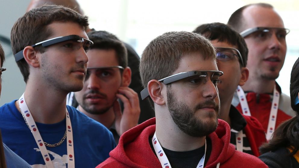 In this file photo, attendees wear Google Glass while posing for a group photo during the Google I/O developer conference on May 17, 2013 in San Francisco, Calif.  