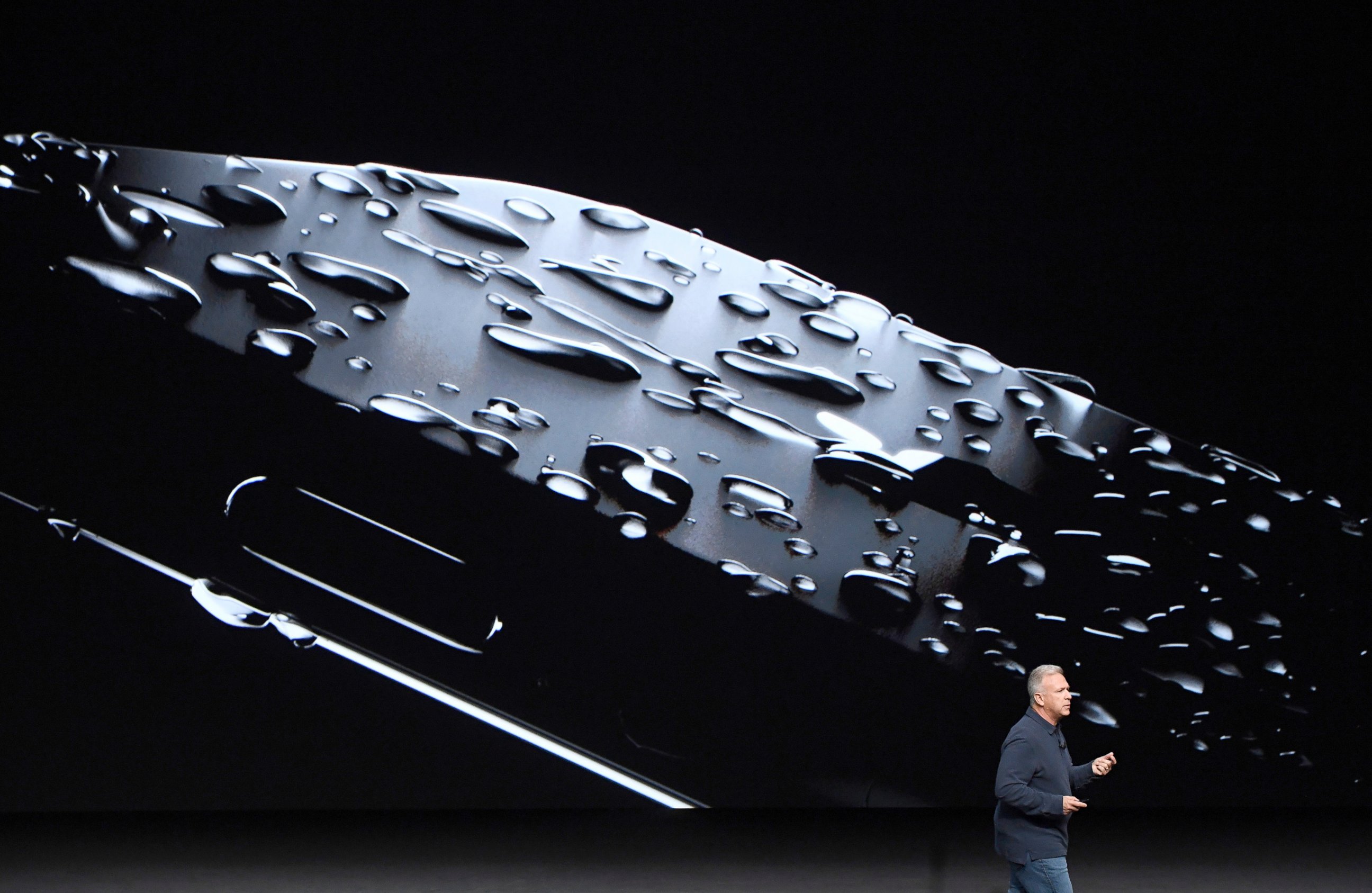 PHOTO: Philip "Phil" Schiller, senior vice president of worldwide marketing at Apple Inc., unveils the new iPhone 7 during an event in San Francisco, Sept. 7, 2016. 