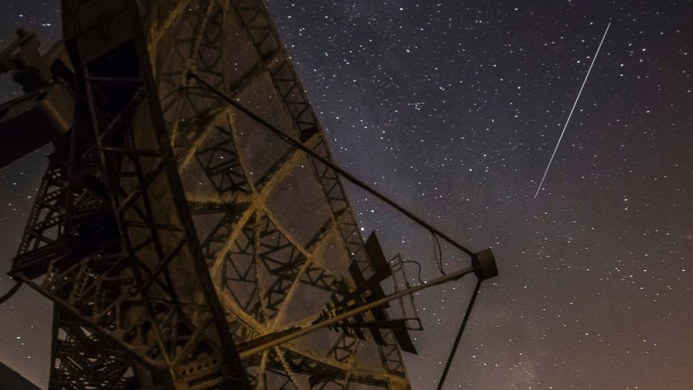 PHOTO: A Perseid meteor streaks across the sky above the radar near the Astronomical Institute of the Academy of Science of the Czech Republic, Aug. 12, 2015 in Ondrejov, Czech Republic.