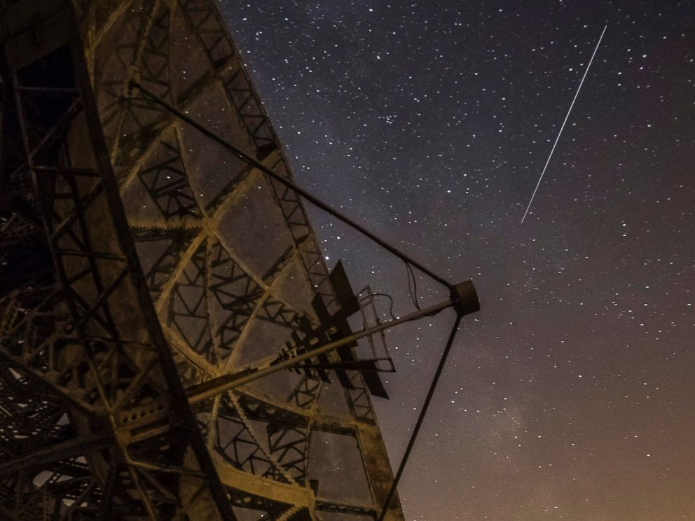 PHOTO: A Perseid meteor streaks across the sky above the radar near the Astronomical Institute of the Academy of Science of the Czech Republic, Aug. 12, 2015 in Ondrejov, Czech Republic.