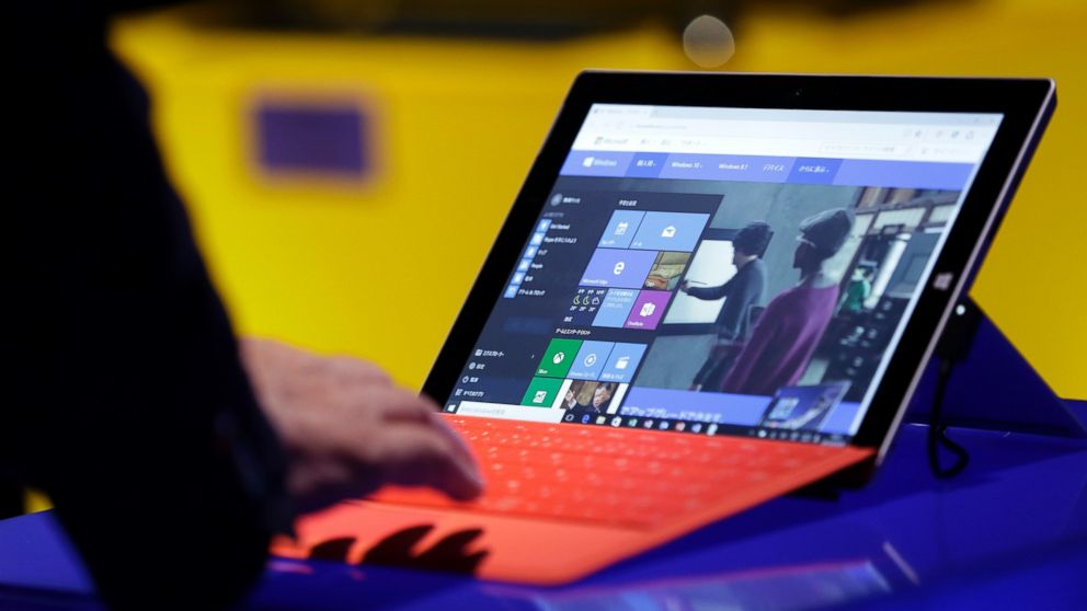 A visitor tries out Microsoft Corp.'s Windows 10 operating system on the Surface 3 tablet device during a launch event in Tokyo, Japan, on July 29, 2015. 
