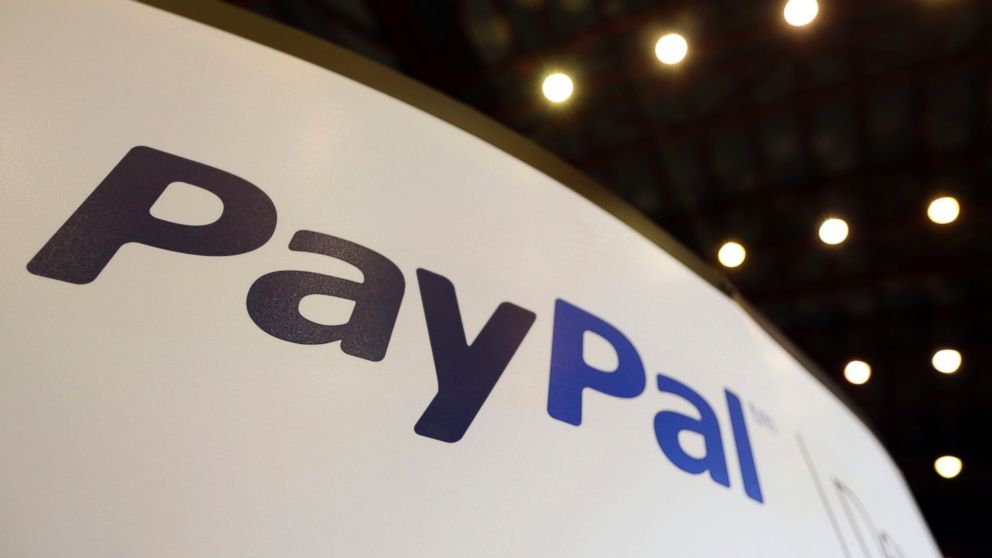 PHOTO: A logo sits on the PayPal company stand, a unit of Ebay Inc., during the Apps World Multi-Platform Developer Show in London, Oct. 23, 2013. 