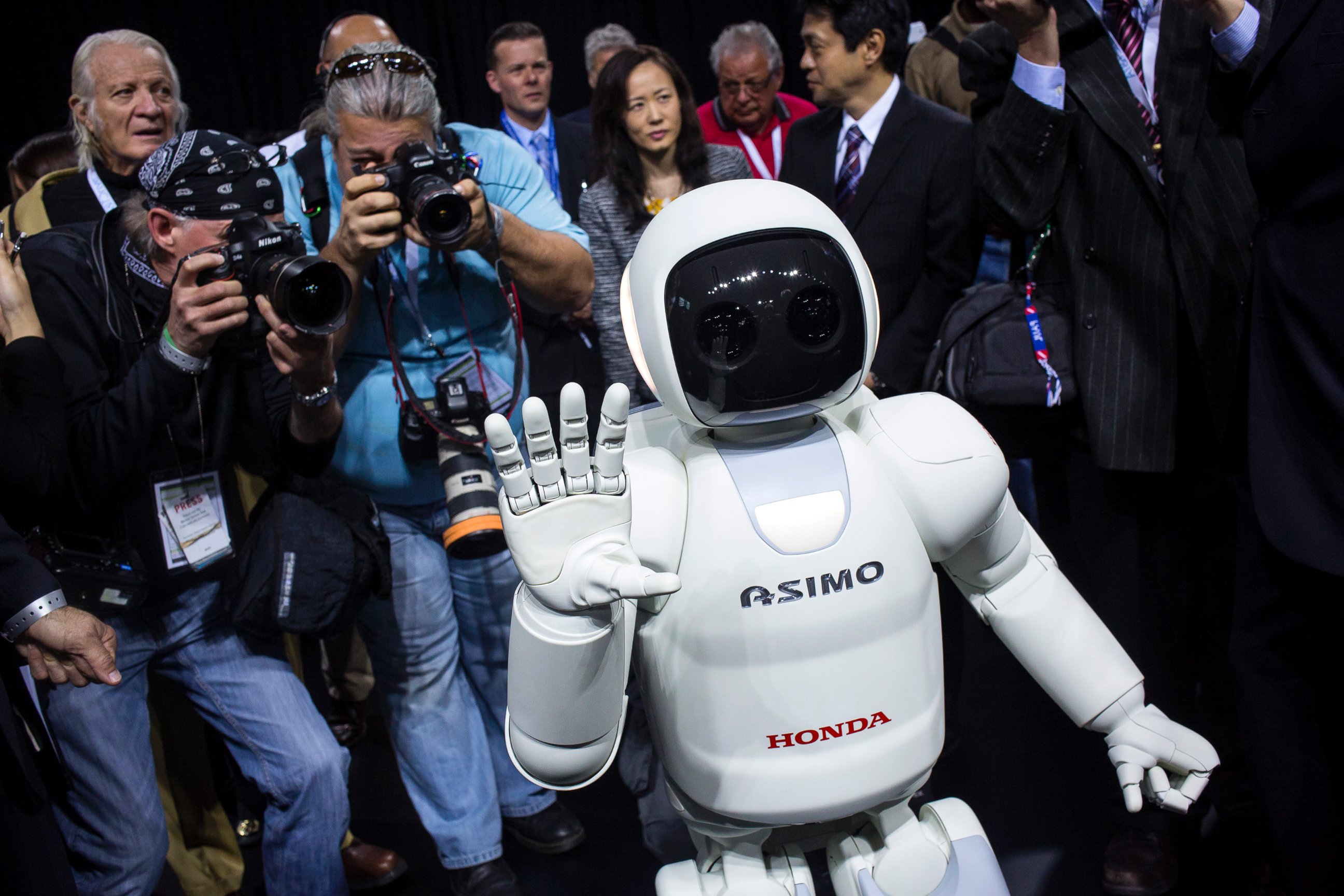 PHOTO: Honda Motors demonstrates its Asimo robot during a media preview of the 2014 New York International Auto Show in New York. The show opens with a sneak preview to the public April 18 and runs through April 27.