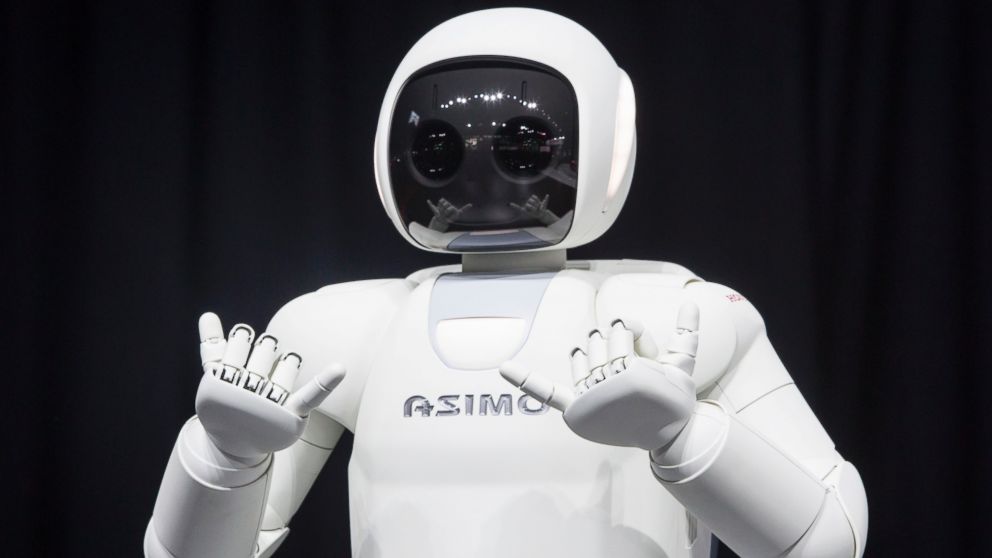PHOTO: Honda Motors demonstrates its Asimo robot during a media preview of the 2014 New York International Auto Show in New York. 
