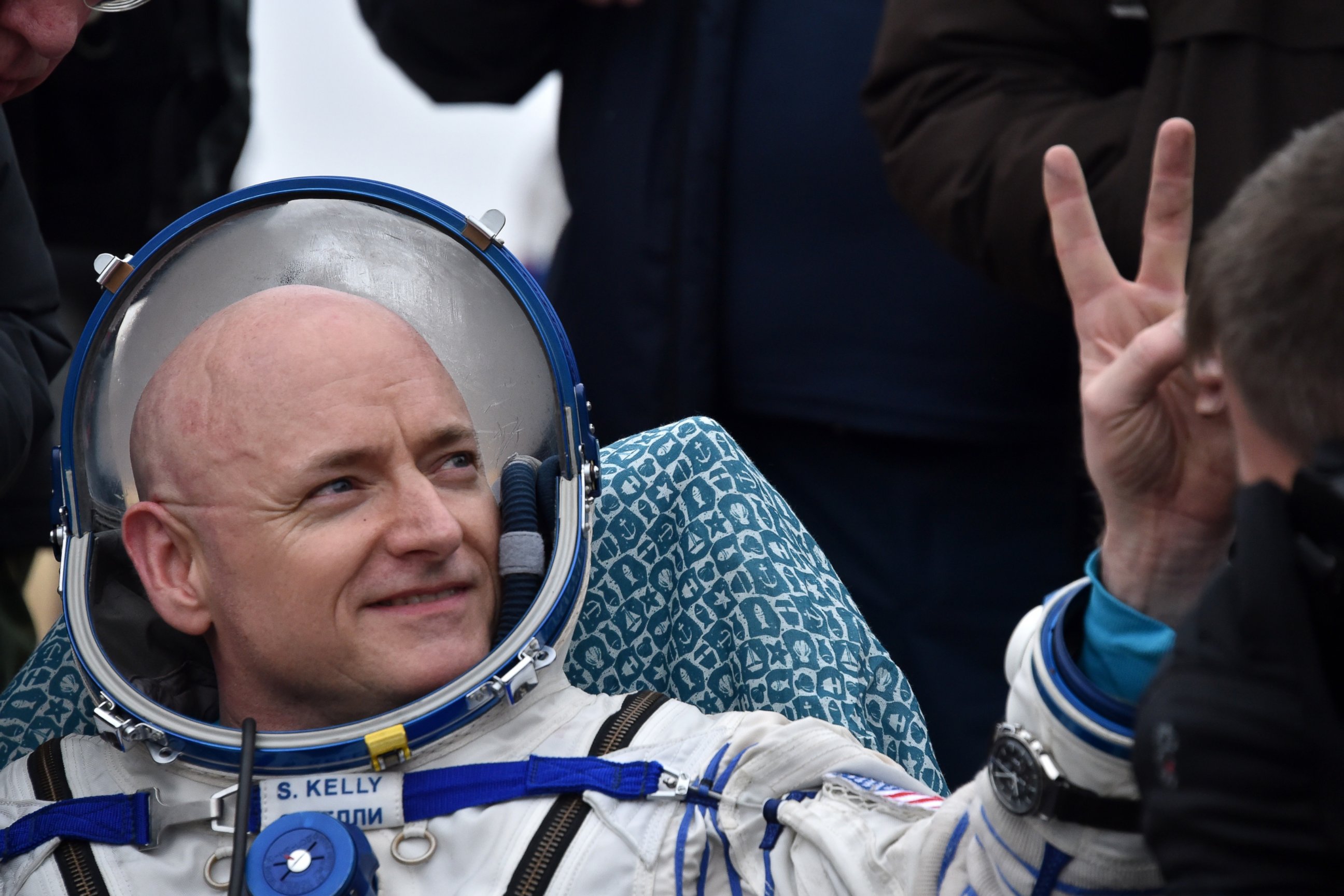 PHOTO: International Space Station (ISS) crew member Scott Kelly of the U.S. shows a victory sign after landing near the town of Dzhezkazgan, Kazakhstan, on March 2, 2016.