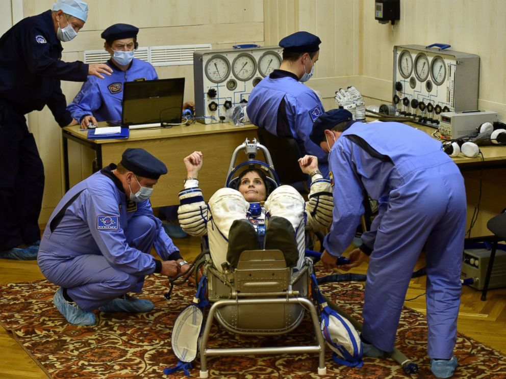 PHOTO: European Space Agencys Italian astronaut Samantha Cristoforetti gestures as her space suit is tested at the Russian-leased Baikonur cosmodrome, prior to blasting off to the International Space Station (ISS), Nov. 23, 2014.
