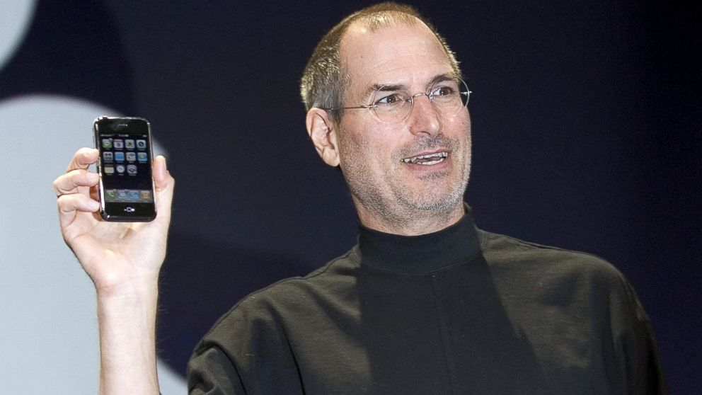 Steve Jobs holds up the new iPhone that was introduced at Macworld, Jan. 9, 2007 in San Francisco.