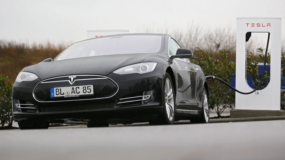 A Tesla S 85 electric car charges at a supercharging station on the A6 highway, Jan. 21, 2014 near Bad Rappenau, Germany. 