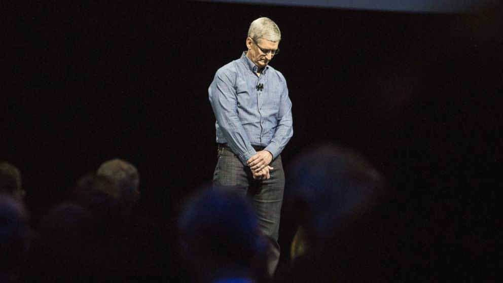 Apple CEO Tim Cook leads the audience in a moment of silence in tribute to the victims of the Orlando shooting at an Apple event at the Worldwide Developer's Conference, June 13, 2016, in San Francisco.