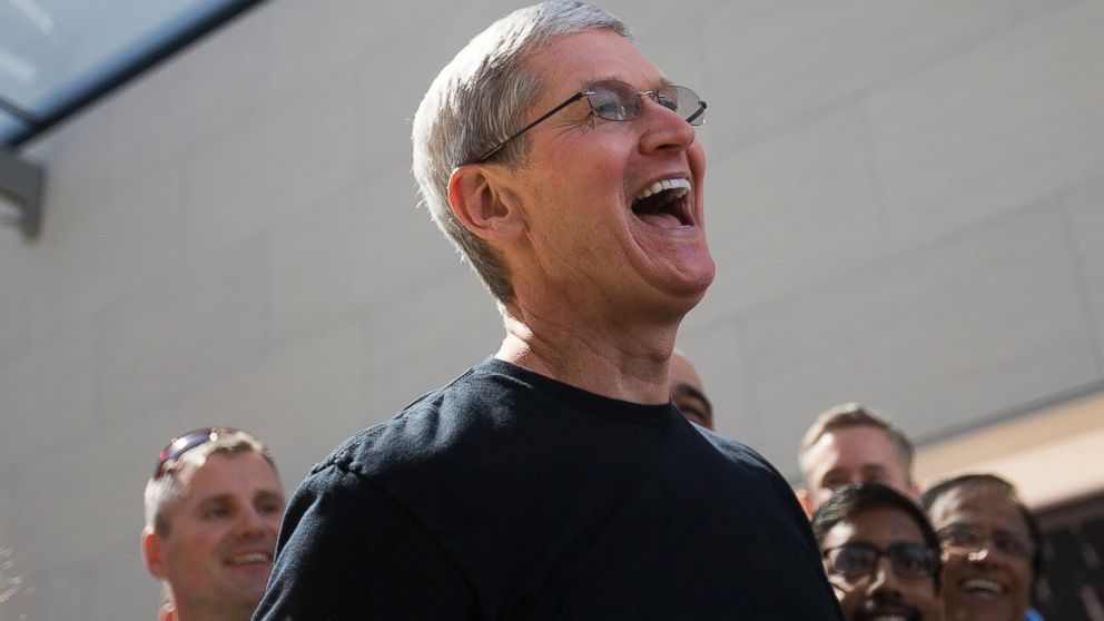 Tim Cook smiles as he visits an Apple Store on April 10, 2015 in Palo Alto, Calif.