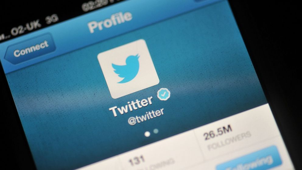 The Twitter logo is displayed in a photo illustration on a mobile device, Nov. 7, 2013 in London.