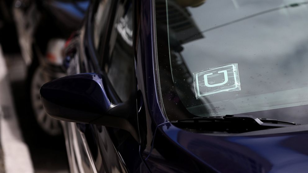 PHOTO: A sticker with the Uber logo is displayed in the window of a car in San Francisco, Calif.
