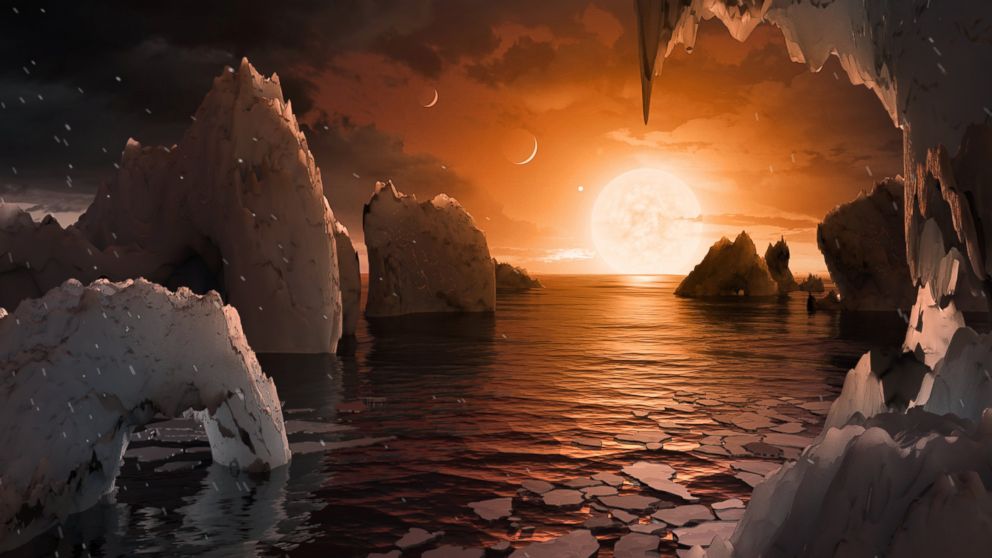 PHOTO: Imagine standing on the surface of the exoplanet TRAPPIST-1f. This artist's concept is one interpretation of what it could look like. 