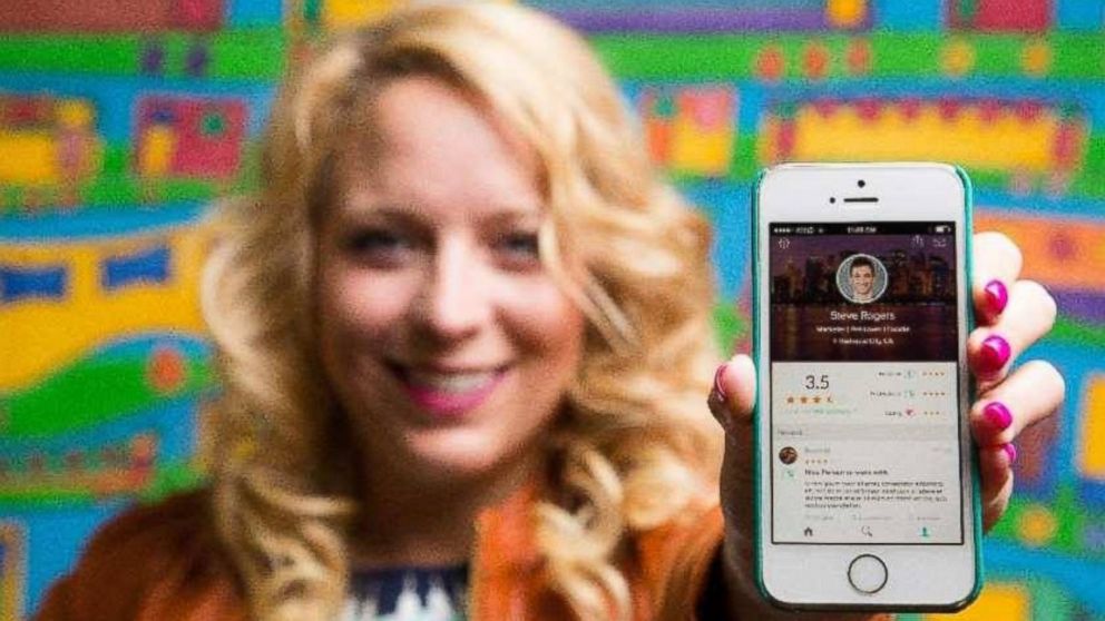 Julia Cordray, the co-founder of Peeple, is pictured holding an iPhone with the Peeple App displayed on it's screen in this undated file photo. 