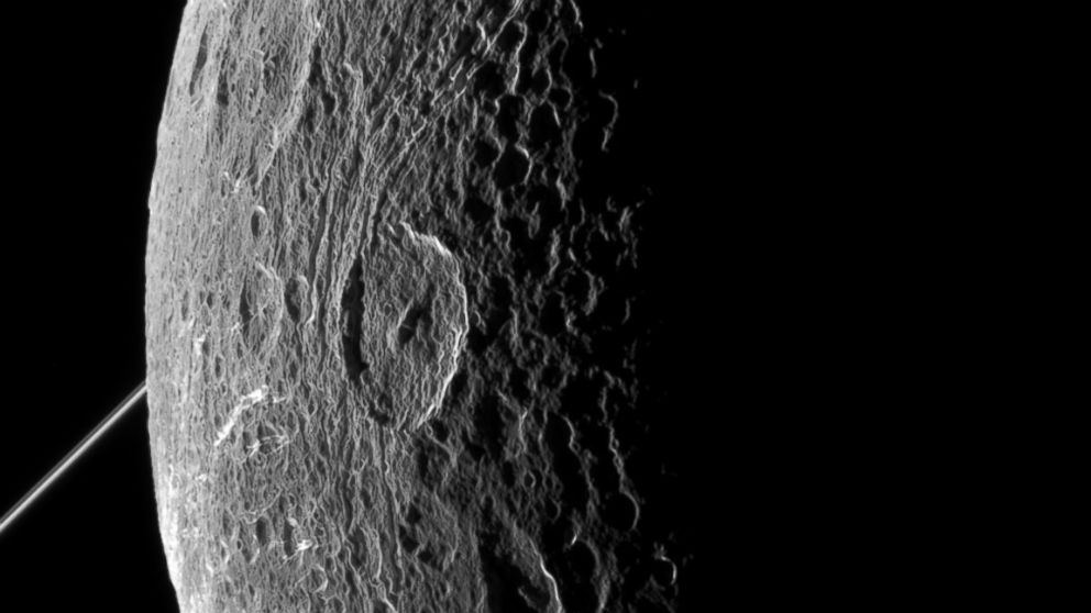 The rugged landscape of Saturn's fracture-faced moon Dione is revealed in images sent back by NASA's Cassini spacecraft from its latest flyby. Cassini buzzed past Dione on June 16, coming within 321 miles (516 kilometers) of the moon's surface.