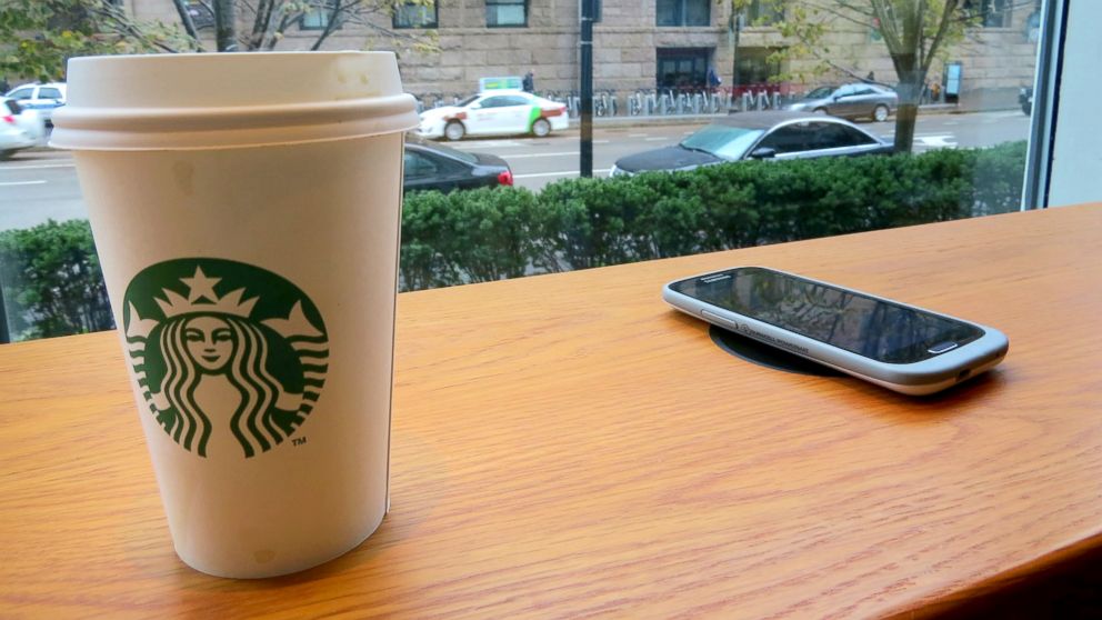 A wireless charging spot is seen here at a Starbucks store.