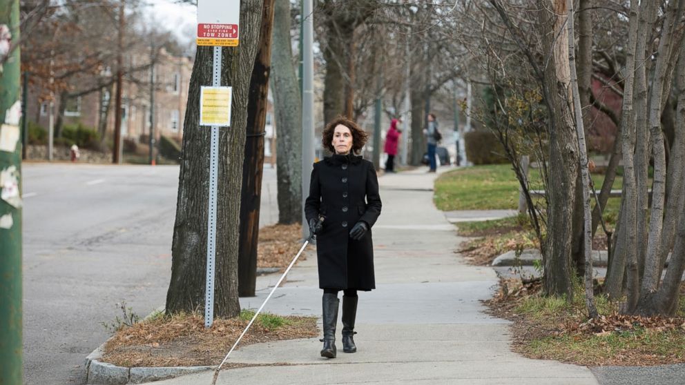 PHOTO: Perkins School for the Blind employee, Joann Becker, travels by bus. It can be hard for people with visual impairments to locate the exact location of bus stops and other landmarks.