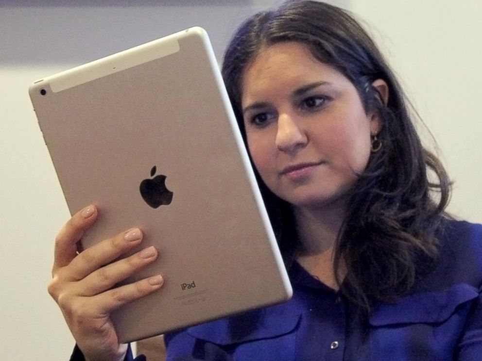 PHOTO: The iPad Air is now much easier to hold in one hand.d Air is now much easier to hold in one hand.