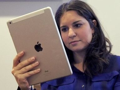 PHOTO: The iPad Air is now much easier to hold in one hand.d Air is now much easier to hold in one hand.