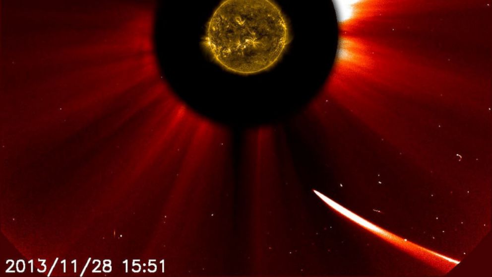 Comet ISON moves closer to the sun in this image composite with the sun imaged by NASA's Solar Dynamics Observatory in the center, and SOHO showing the solar atmosphere, the corona captured at 10:51 a.m. EST, Nov. 28, 2013.