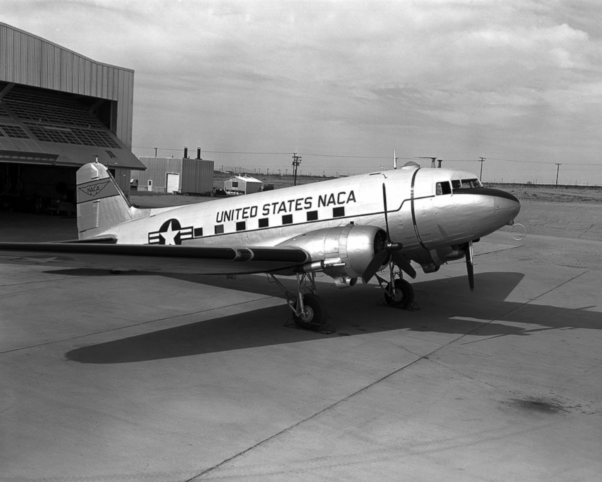 PHOTO: The first of three Douglas R4D Skytrain aircrafts is seen on the ramp behind the NACA High-Speed Flight Station, 1956.