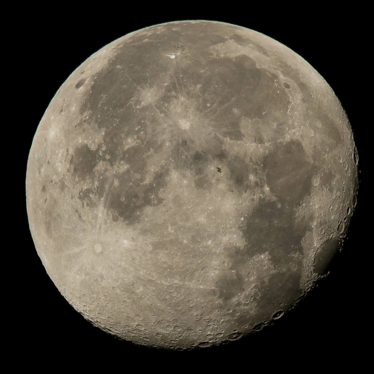 PHOTO: The International Space Station is seen crossing the moon August 2, 2015.