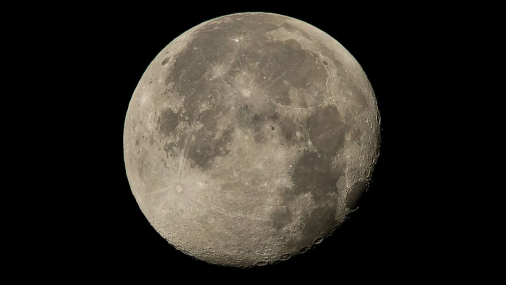 The International Space Station is seen crossing the moon August 2, 2015.