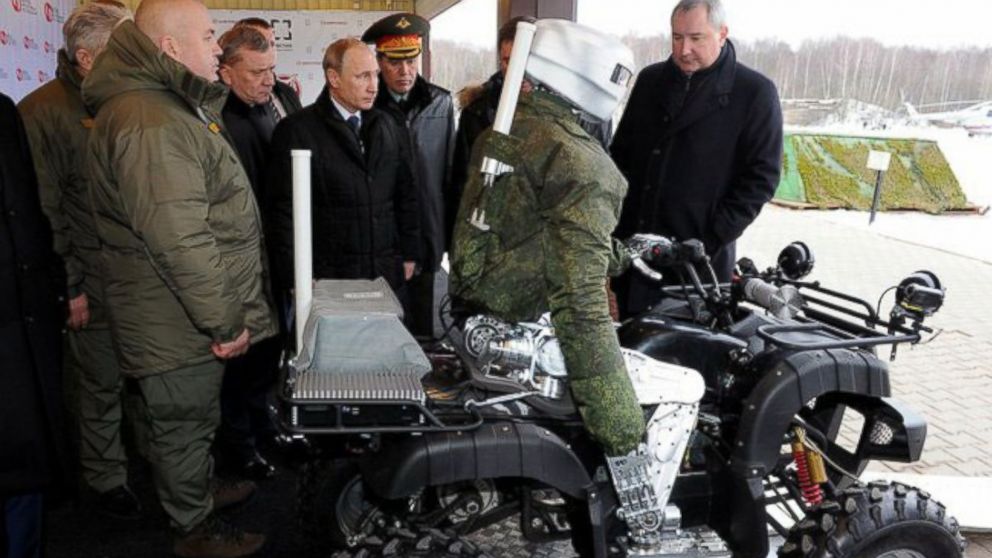 Vladimir Putin checks out a robot.