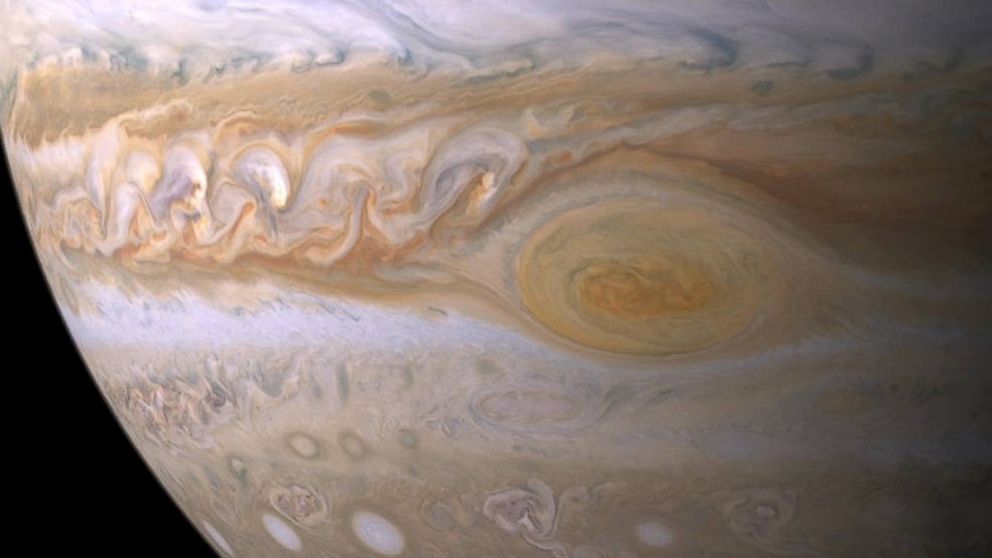 Trapped between two jet streams, the Great Red Spot is an anticyclone swirling around a center of high atmospheric pressure that makes it rotate in the opposite sense of hurricanes on Earth.