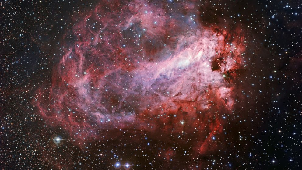 This image shows the rose-coloured star forming region Messier 17.   