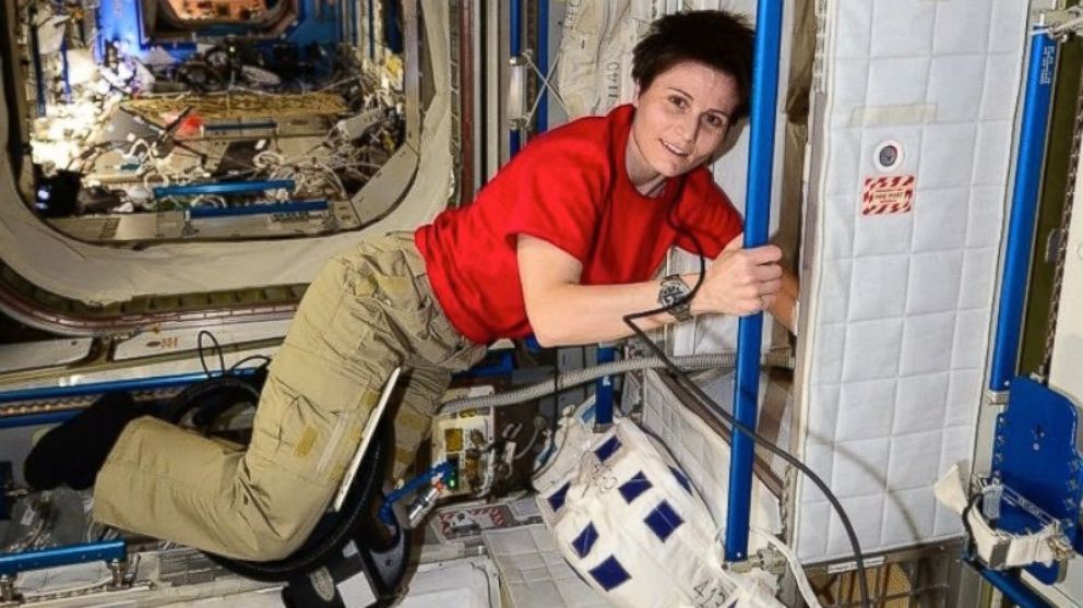 PHOTO: Italian astronaut Samantha Cristoforetti uses a vaccuum at the International Space Station