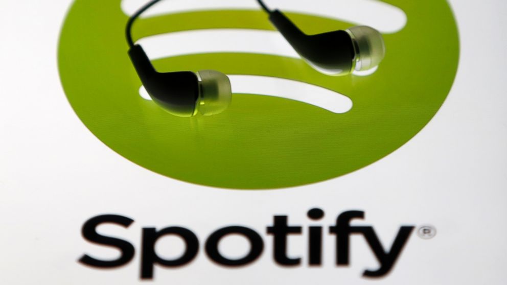 PHOTO: Earphones are seen on a tablet screen with a Spotify logo on it in Zenica, Bosnia and Herzegovina, Feb. 20, 2014. 