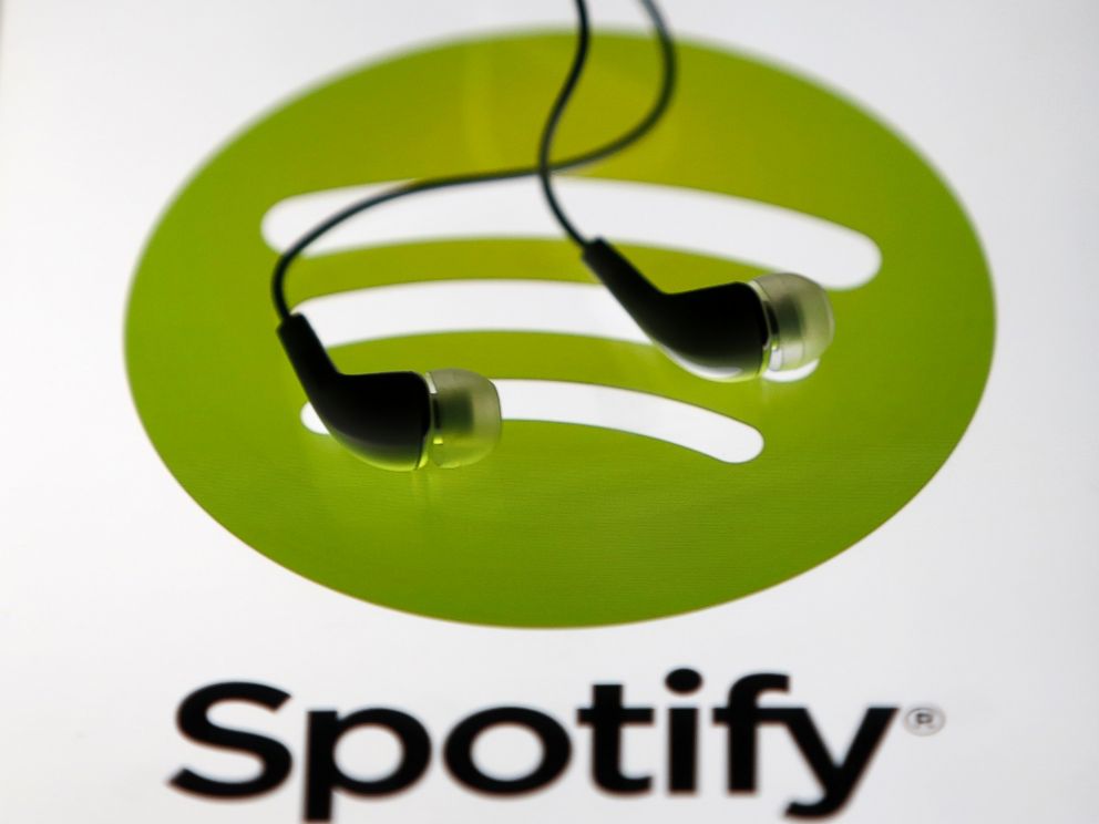 PHOTO: Earphones are seen on a tablet screen with a Spotify logo on it in Zenica, Bosnia and Herzegovina, Feb. 20, 2014. 