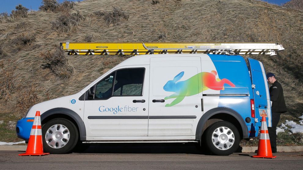 A Google Fiber technician gets supplies out of his truck to install Google Fiber in a residential home in Provo, Utah in this Jan. 2, 2014 file photo. 
