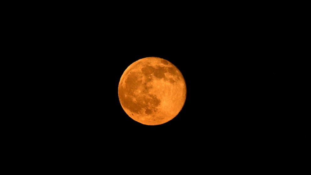 PHOTO: The Summer Solstice moon is shown through the haze of the so-called Fish Fire above Azusa, Calif. June 20, 2016.