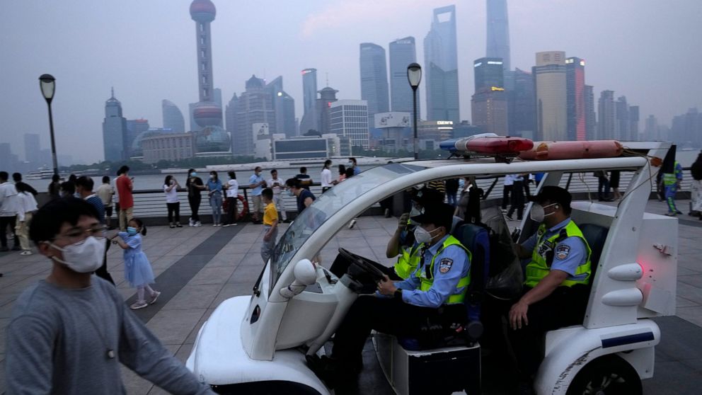 Chinese policemen patrol the bund area, Wednesday, June 1, 2022, in Shanghai. Hackers claim to have obtained a trove of data on 1 billion Chinese from a Shanghai police database in a leak that, if confirmed, could be one of the largest data breaches 