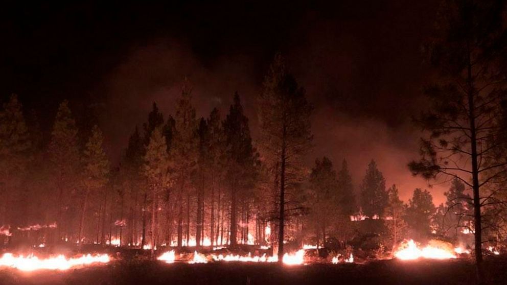 Erratic Oregon wildfire destroys dozens of homes, expands