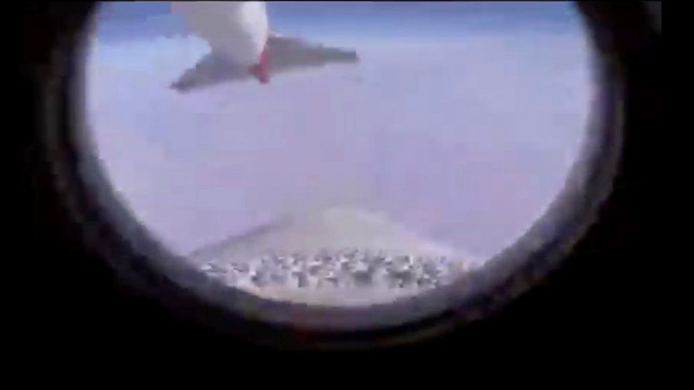 In this image from video made available by Virgin Orbit, the tail of a modified 747 jet is seen from the LauncherOne rocket as it separates from underneath the aircraft's wing over the Pacific Ocean, during a mission to deliver satellites from three 