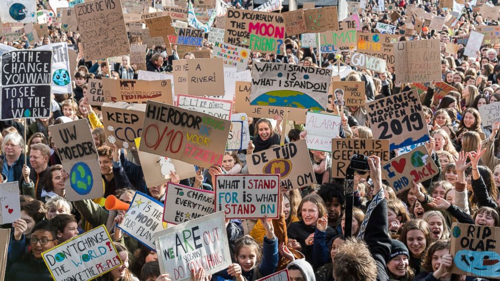 People march during a climate change protest in Leuven, Belgium, Thursday, Feb. 7, 2019. A Belgian Environment Minister has been forced to resign after saying she had state security confirmation that massive climate demonstrations in recent weeks wer