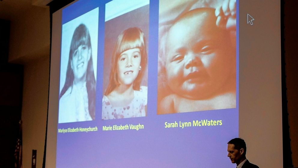 New Hampshire Senior Assistant Attorney General Jeffery Strelzin shows a slide of the three identified victims, Marlyse Honeychurch, left, and her daughters Marie Elizabeth Vaughn and Sarah Lynn McWaters at a press conference at the Department of Saf
