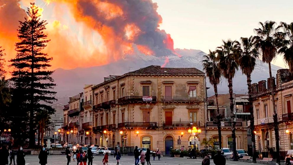 Mount Etna, Europe’s most active volcano, spews ash and lava, as seen from Catania, southern Italy, Tuesday, Feb. 16, 2021. Mount Etna in Sicily, southern Italy, has roared back into spectacular volcanic action, sending up plumes of ash and spewing l